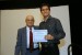 Dr. Nagib Callaos, General Chair, giving Prof. Marcus Vinicius Dantas de Assunção the best paper award certificate of the session "Cognition/Knowledge, Communication and Management (CKSE / KGCM / WMSCI)". The title of the awarded paper is "The Co-Existence of Presenteeism and Commitment Organizational: An Institute of Tecnhical and Techonlogical Education Perspective."